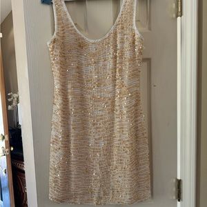 Mini sleeveless white & gold sequin prom or social affair dress. Dry clean only.